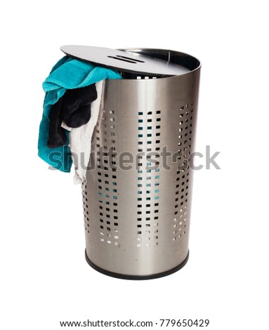 Dirty laundry in a metal basket, isolated on a white background