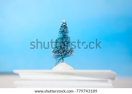 winter still life scenery with fir tree and paper snow

