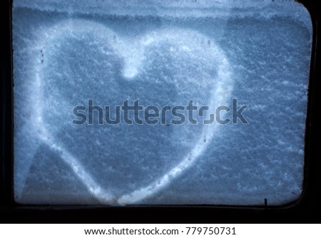 Heart is pictured in the snow.A declaration of love in the snow.