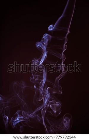 
Purple abstract smoke streams against a black background