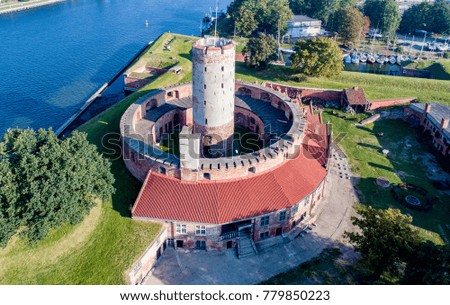 Medieval Wisloujscie Fortress with old lighthouse tower in port of Gdansk, Poland
A unique monument of the fortification works. Aerial view