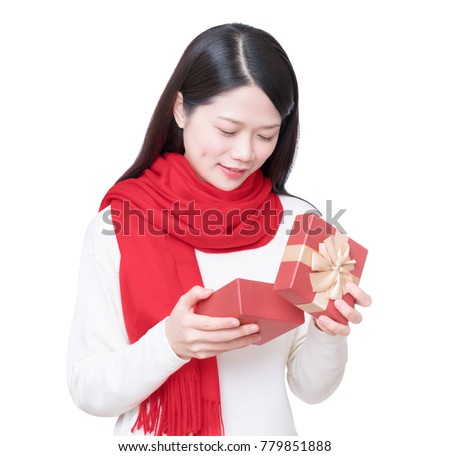 Chinese girl opening a surprise present in gift box