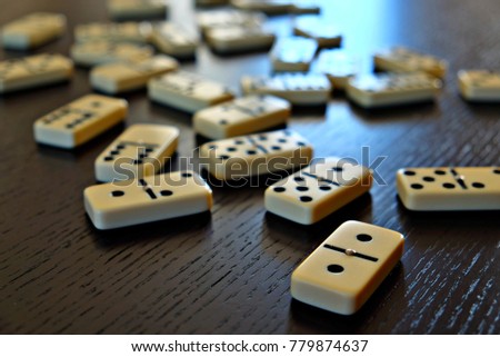 domino tiles arranged randomly on the table