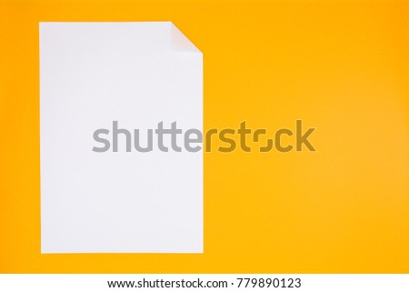 white paper sheet on yellow background