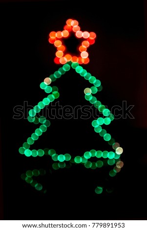 Christmas tree lights shape. Silhouette of illuminated Christmas tree.