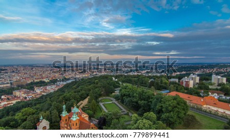 Wonderful timelapse View To The City Of Prague From Petrin Observation Tower In Czech Republic. Blue cloudy sky before sunset
