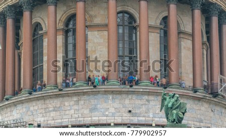 The top of Saint Isaac's Cathedral timelapse in Saint-Petersburg, Russia. Tourists on the colonnade