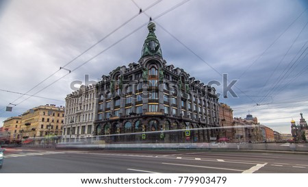 Singer House at the Saint Petersburg timelapse hyperlapse with traffic on road. Tourists walk near Singer House, located at the of Nevsky Prospekt and the Griboyedov Canal