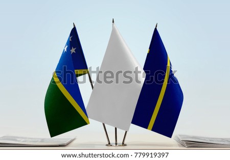 Flags of Solomon Islands and Nauru with a white flag in the middle