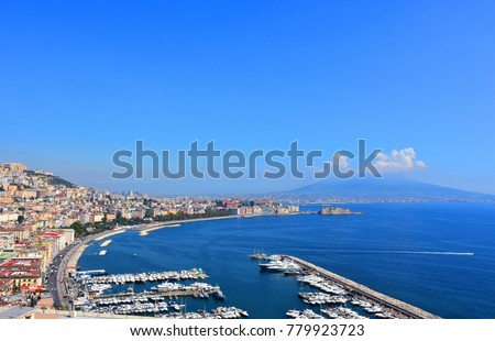 Italy, Naples, view of via Caracciolo and of the port of Mergellina with the Vesuvius in the background, from via Orazio. Royalty-Free Stock Photo #779923723