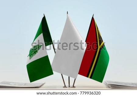 Flags of Norfolk Island and Vanuatu with a white flag in the middle
