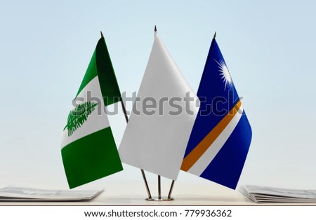 Flags of Norfolk Island and Marshall Islands with a white flag in the middle