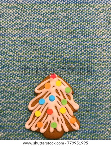 Gingerbread on empty surface with colorful decoration.