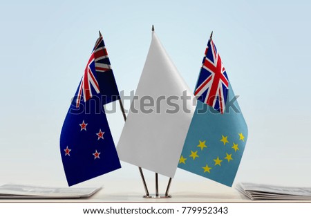 Flags of New Zealand and Tuvalu with a white flag in the middle