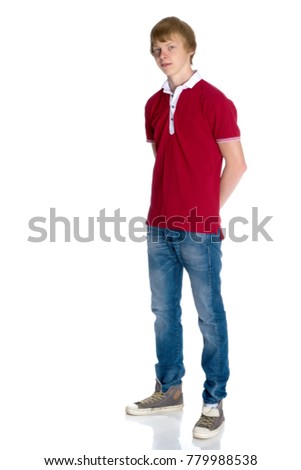 A young red-haired guy in a shirt and jeans. Isolated on white background.
