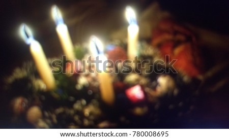 blurred image of advent wreath with stollen on table