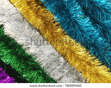 Multi-coloured Christmas tinsel background