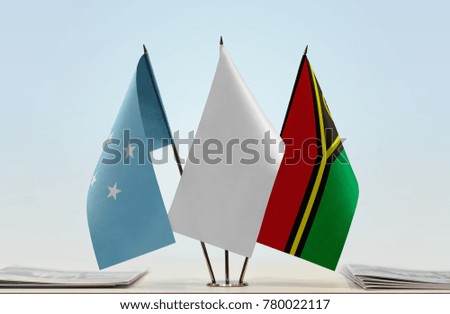 Flags of Federated States of Micronesia and Vanuatu with a white flag in the middle