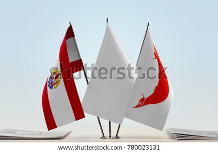 Flags of French Polynesia and Easter Island with a white flag in the middle