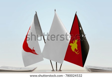Flags of Easter Island and Papua New Guinea with a white flag in the middle