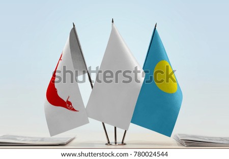 Flags of Easter Island and Palau with a white flag in the middle