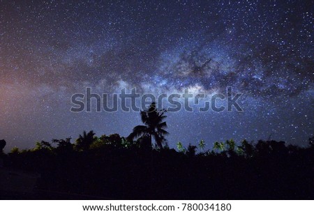 Milky Way galaxy rising from Sabah, North Borneo. Long exposure and high ISO photograph. with visible grain and noise, blur, and soft focus.
