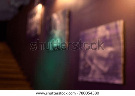 Interior of room. Paintings on wall. Blurred Background.