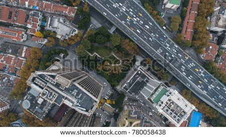 aerial view of city buildings and highway in cloudy day