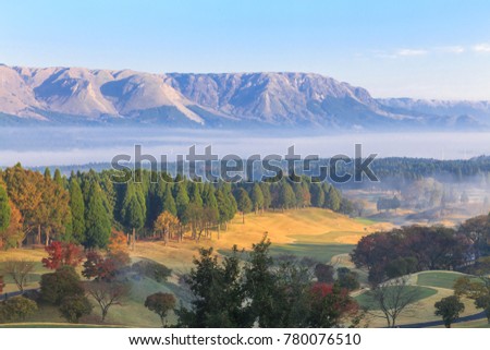 Beautiful pictures of mountains and mist,Pine trees and trees change color Including a golf course in the morning at ASO,Kumamoto prefecture,Japan