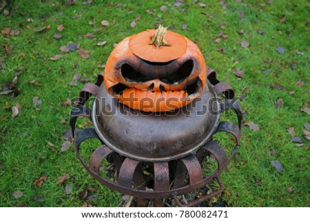 burnt pumpkin on fire basket