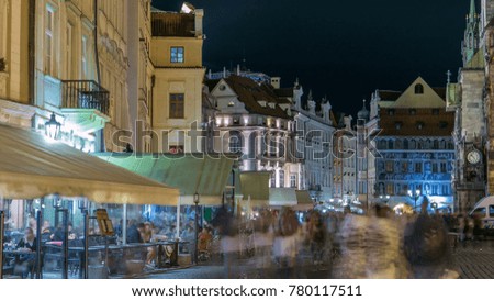 Night view of Old Town Square timelapse in Prague. Czech Republic. People walk near restaurants
