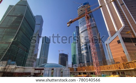 Tower cranes on construction site before skyscrapers of Moscow-city timelapse. Moscow, Russia.