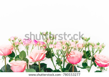 Flowers roses, branches and leaves on white background. Flat lay, Top view. Roses flower texture