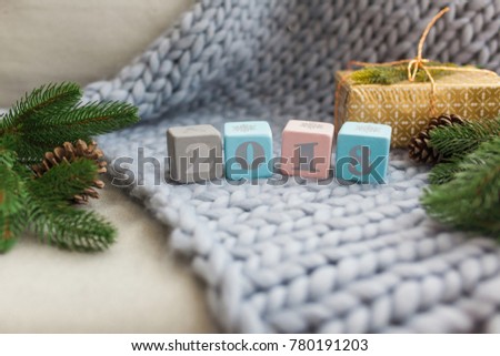 wooden cubes 2018 on a blue plaid of large mating. new year and christmas concept