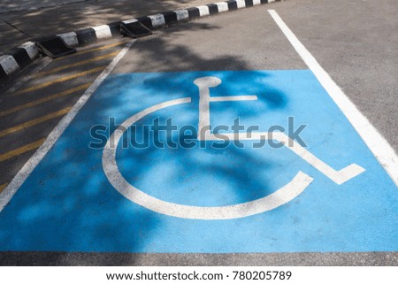 Disabled parking sign on road