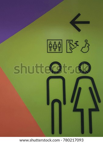Toilet symbol on the wall background with male and female.