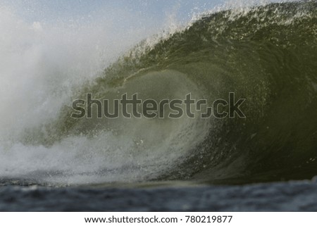 Perfect Green emerald Barreling surf waves of the Atlantic Ocean.