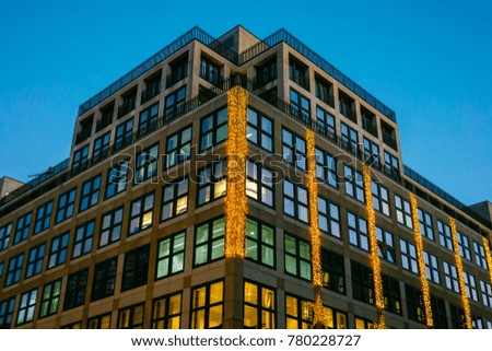 office building with christmas lights on the facade