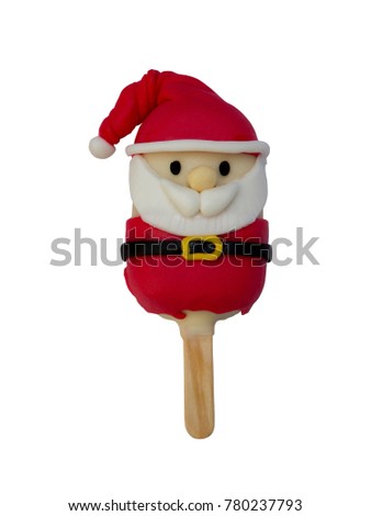 Christmas candies and ice cream decorated as santa claus on white background. New year and Christmas composition