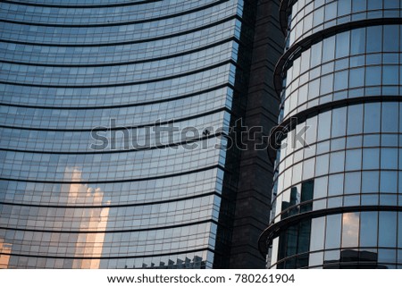Corporate concept - detail of modern glass building in Milan