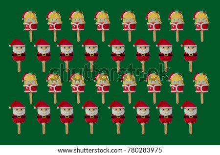 pattern of Christmas candies and ice cream decorated as santa claus and girls on green background. New year and Christmas composition
