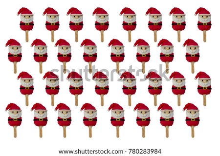 pattern of Christmas candies and ice cream decorated as santa claus on white background. New year and Christmas composition