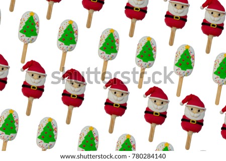 pattern of Christmas candies and ice cream decorated as santa claus and Christmas tree on white background. New year and Christmas composition