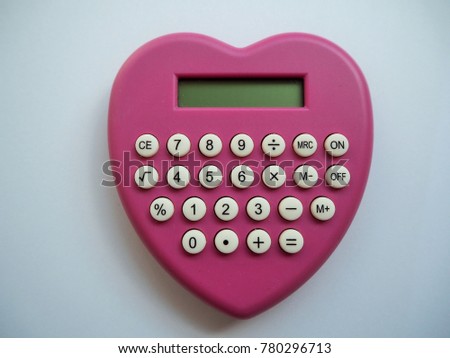 Pink calculator heart shape. On white background.