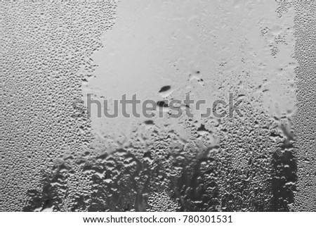 Macro of water drops frosted closeup on glass texture background