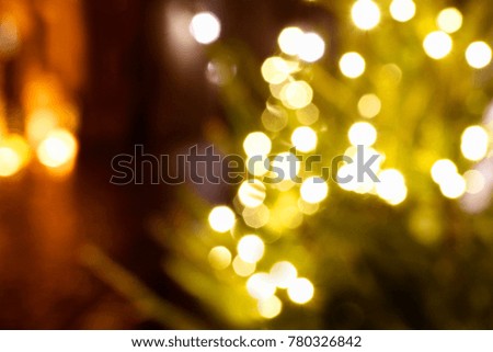 Abstract background with blurred Christmas tree on the street by night. 