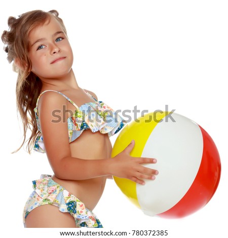 Little girl in a swimsuit with a big ball. The concept of children's recreation at sea, playing on the beach, Happy childhood. Isolated on white background.