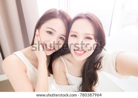 two beauty woman selfie happily in the home