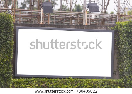 blank billboard in bush frame with spot light
