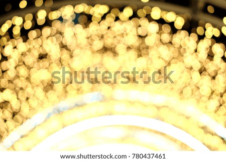 Multicolored Christmas and New Year glowing and golden light Abstract bokeh and blurred background.Lighting decorations on celebrations display in the night.Christmas and holiday concept.